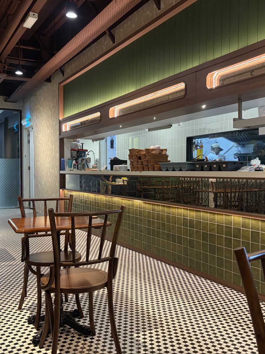 Open kitchen counter with green tiles